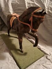 hand made wooden horse ornament well detailed with saddle  and stand.