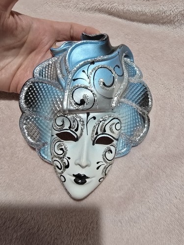 Wall hanging face - wall,