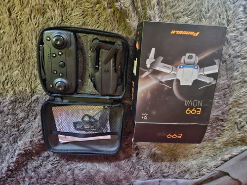 New and boxed e99 quadrocopter - and,
