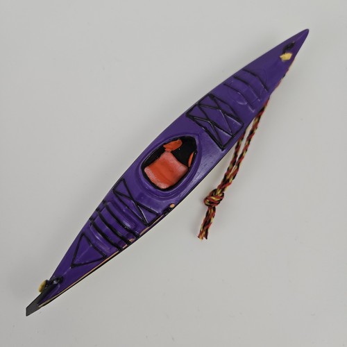 Touring purple kayak outside - touring,