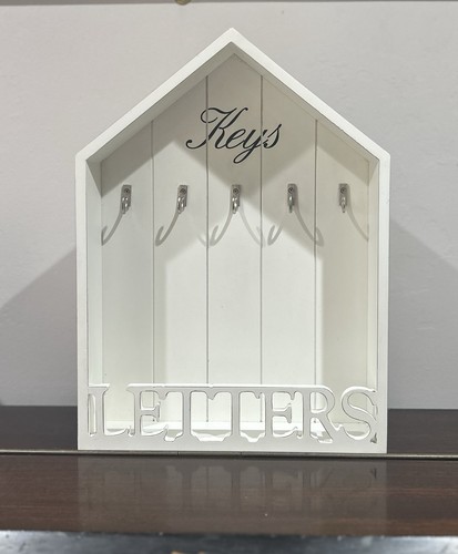 White wooden house - shaped, key