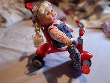 Kid Concepts Baby Doll and Red Trike with extendable handle.