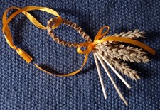 Handmade rustic Corn Dolly Straw Loop Favour with orange satin ribbons