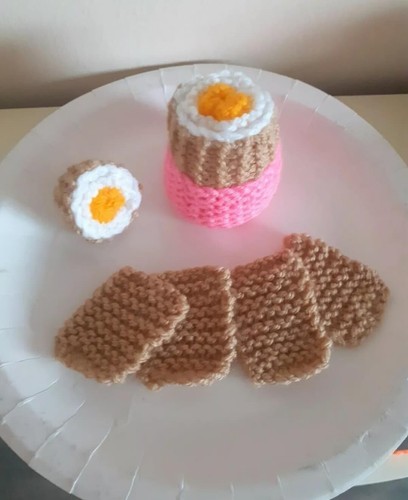 Hand knitted boiled egg - hand,