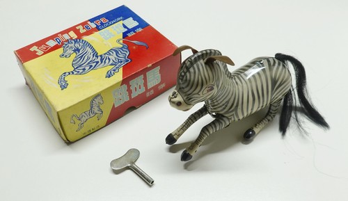 Jumping zebra clockwork - •,
