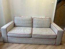 Beige 3 seater sofa with red