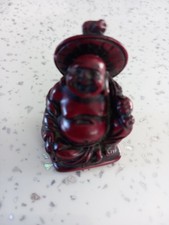 Six miniature Smiling Buddha