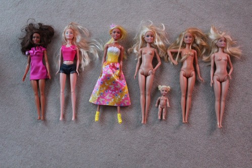 Six barbie dolls and baby - dolls,