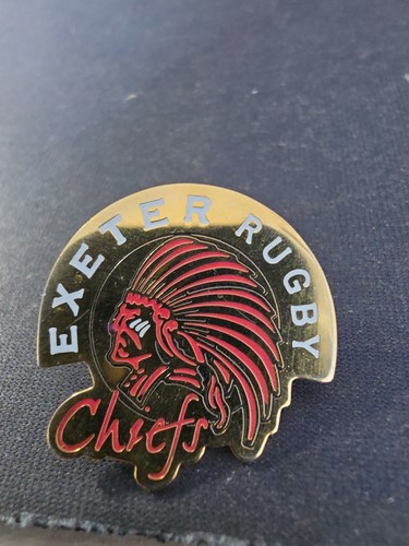 Badge featuring the - badge,