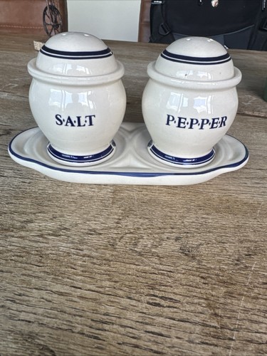 Salt pepper shakers on - salt, stand