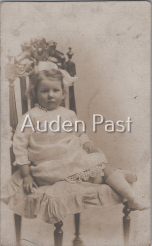 Rppc little girl - ornate, chair