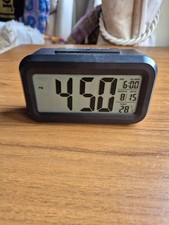 Battery Operated  Alarm Clock. Also Shows  Day, Month And Temperature.