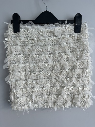 Preowned ivory mini skirt with