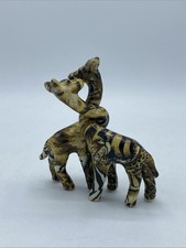 Entwined Giraffe Figures By