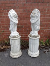 Pair stone lion statues on