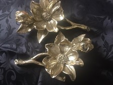 TWO GOLD COLOURED WALL DECORATIONS FLOWERS