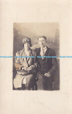 R372476 A man in a suit next to a woman with a hat and bag 1929