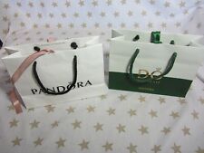  2 Pandora Empty gift bags. 16cm x 22cm x 7cm bags. Pink/ Green Ribbons on top.