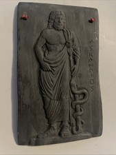 Plaster wall plaque depicting