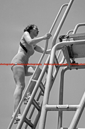 F000496 woman climbing a - woman, on