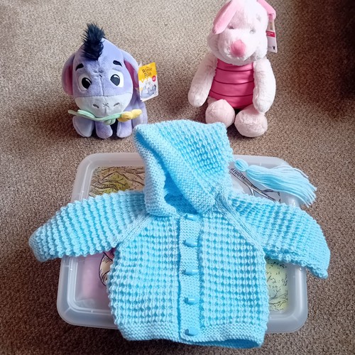 Hand knitted baby - hand,