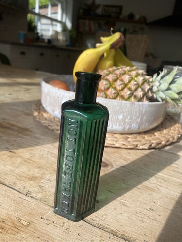 Antique green glass poison - green,