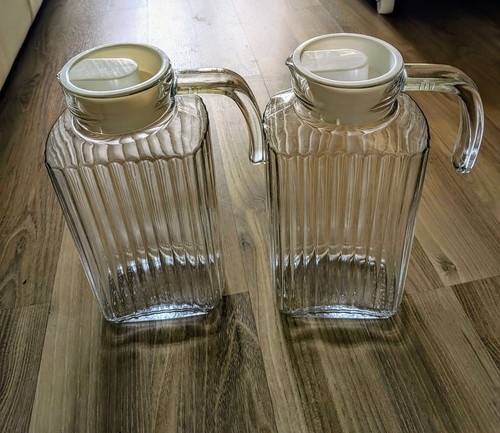 Two glass water jugs with - glass,