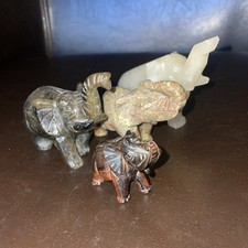 A Collection of 4 Hand Carved