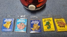 Pokemon Pokeball containing 5 metal pin badges
