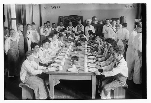 Students seated table at - a,