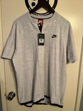 nike tech knit button collar t