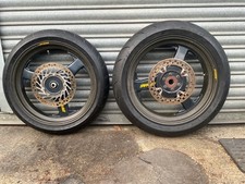 PAIR OF CARBON FIBRE DYMAG