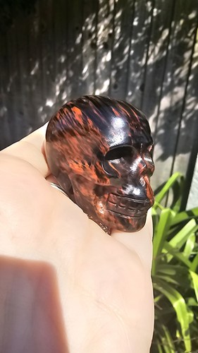 Carved mahogany obsidian skull - carved,