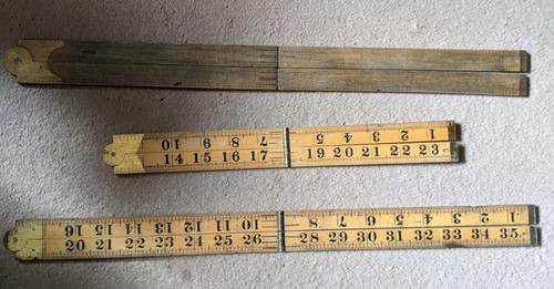 Three folding wooden - , rulers