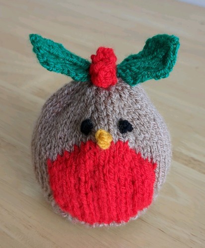 Handmade hand knitted robin - hand,
