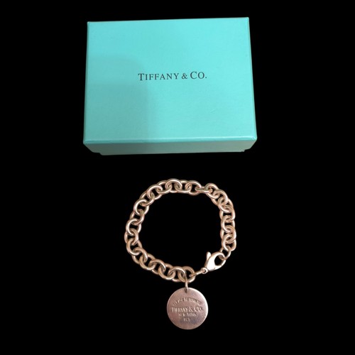 Tiffany please return to - &, co.