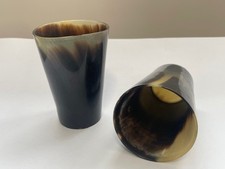Vintage drinking vessels. Bovine horn shot glass Dice shaker each unique pair