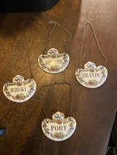An Attractive Set of Four Fine Bone China Crown Staffordshire Decanter Labels