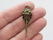 6 Bird skull pendants antique