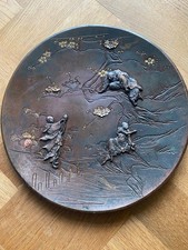 Japanese bronze plate relief figures and flowers damaged 27.5 cm dia approx 650g