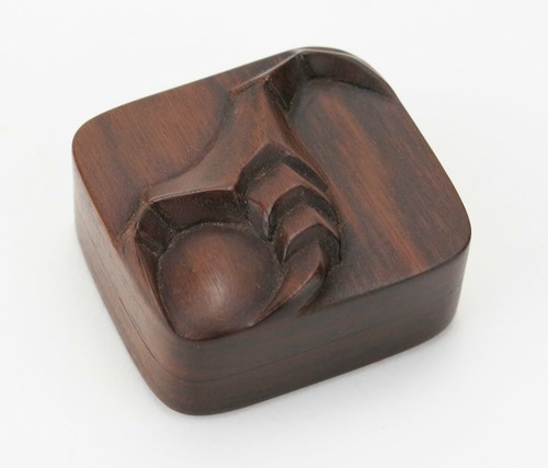 Exquisite carved walnut treen