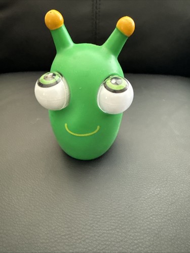Decompressing toy green worm - decompressing,