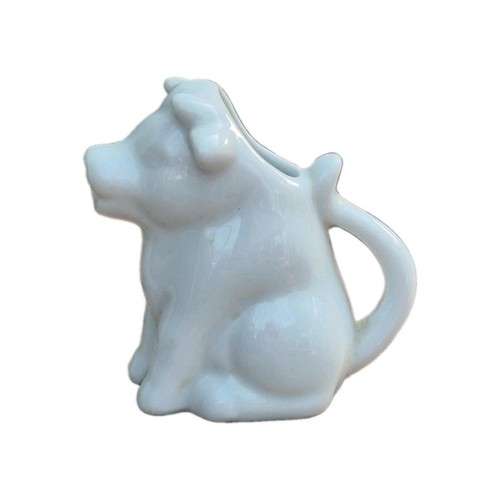 White porcelain seated cow - porcelain,