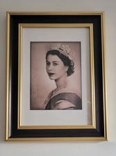 Black and gold framed portrait
