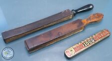 TWO ANTIQUE BARBER LEATHER PADDLE STROPS AND A OLD ADVERTISING TIN