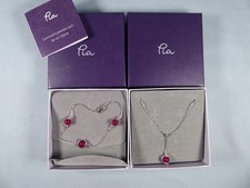 Pia - Bracelet and Pendant both with red stones