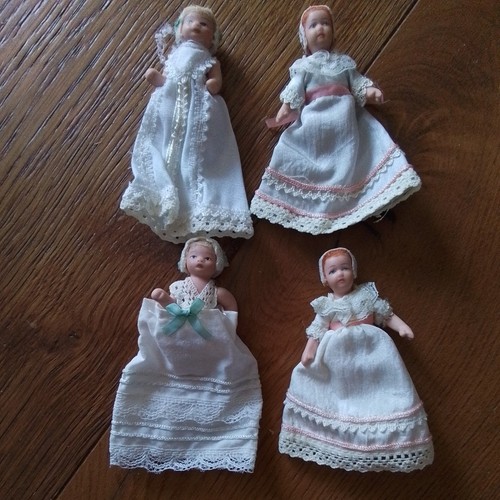 Four porcelain dolls - four, house