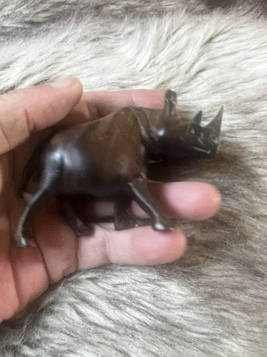 Hand carved wooden - hand, rhinoceros