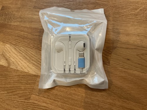 Ear phone and charger unopened - and,