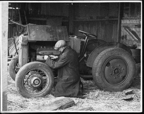 Farmer works his aged - on,